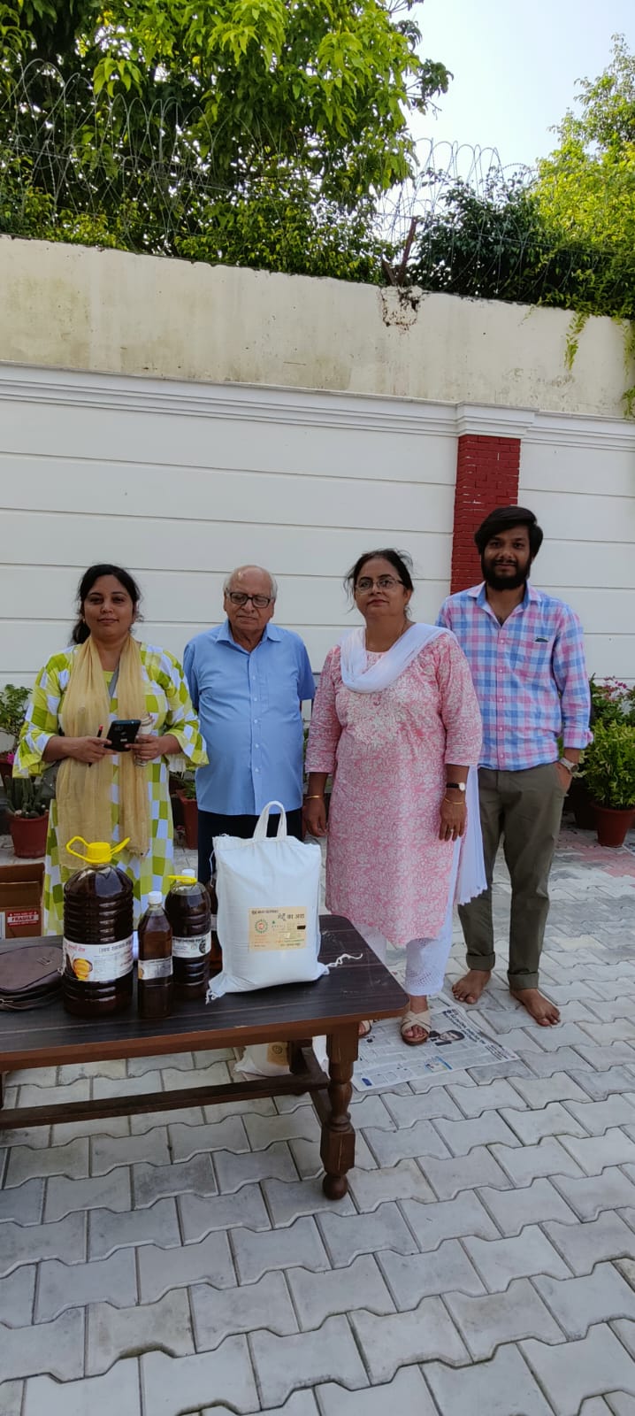 PAC members standing with packaged products